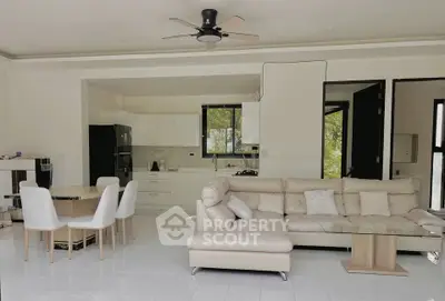 Spacious modern living room with open kitchen and elegant furniture