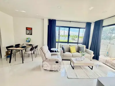 Bright and spacious living room with modern furniture and large windows
