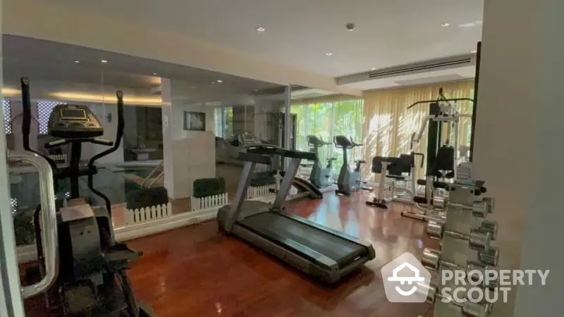 Luxurious home gym with modern equipment and natural light