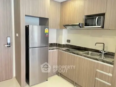 Modern kitchen with stainless steel appliances and sleek cabinetry