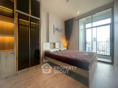 Modern bedroom with city view and stylish wooden wardrobe