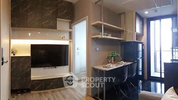 Modern living room with sleek marble accents and open layout dining area