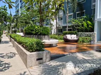 Luxurious garden area with modern seating in a high-end residential complex.