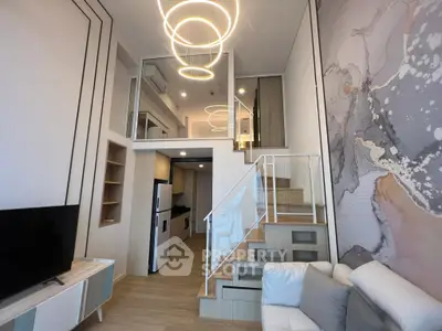 Modern loft apartment with stylish lighting and open kitchen layout