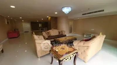 Luxurious living room with elegant furniture and chandelier in spacious apartment