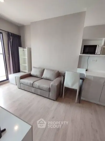 Modern living room with cozy sofa and sleek furniture in a bright apartment