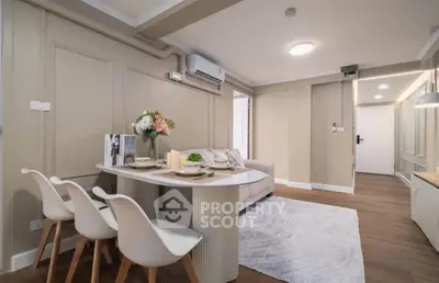 Stylish modern living room with elegant dining area and cozy seating, perfect for urban living.