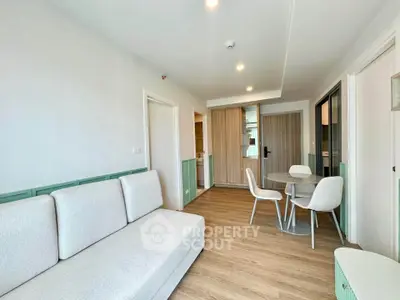 Modern living room with stylish furniture and wooden flooring in a contemporary apartment.