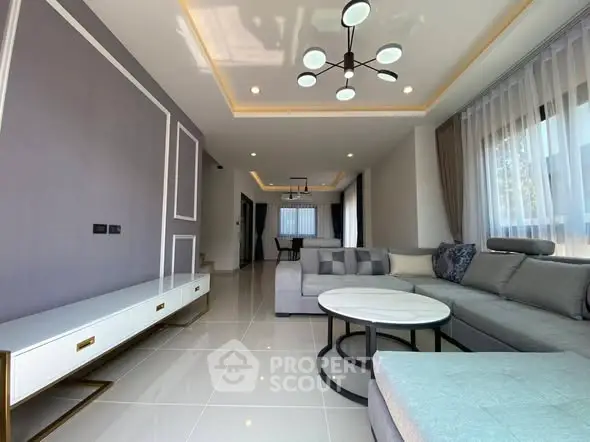 Spacious modern living room with elegant lighting and stylish furniture