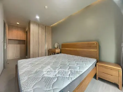 Modern bedroom with wooden furniture and cozy lighting