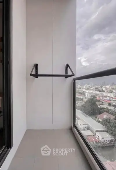 Modern balcony with city view and sleek glass railing