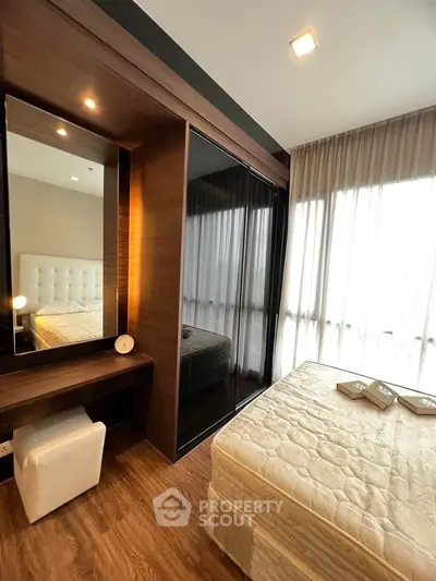 Modern bedroom with elegant wooden accents and ample natural light