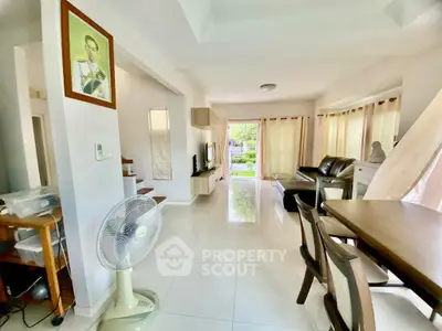 Spacious living room with modern decor and garden view