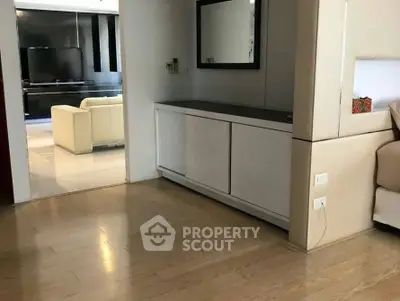 Spacious modern living area with sleek design and wooden flooring