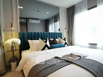 Luxurious bedroom with plush bedding and elegant decor in modern apartment
