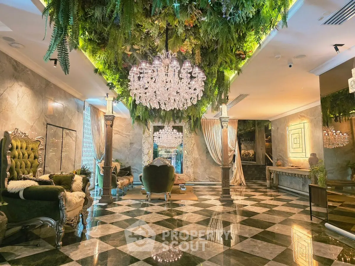 Luxurious living room with elegant chandeliers and lush greenery ceiling