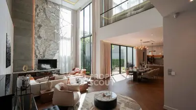 Luxurious modern living room with high ceilings and elegant decor