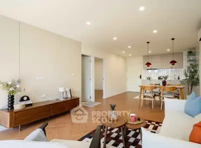 Spacious open-plan living room with modern kitchen and stylish decor