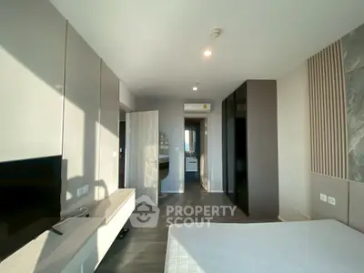 Modern bedroom with sleek design and ample natural light