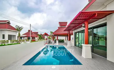 Luxurious villa with private pool and modern architecture in tropical setting.