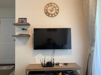 Modern living room with wall-mounted TV and stylish decor