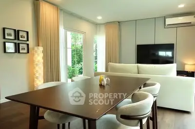Modern living room with elegant dining area and stylish furniture