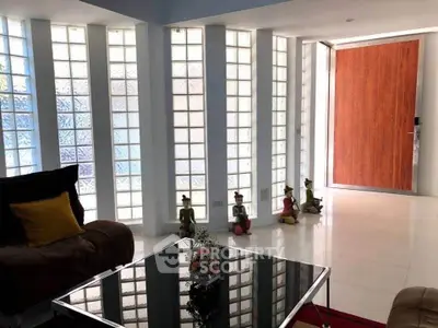Modern living room with glass block wall and stylish decor