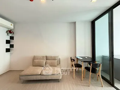 Modern living room with cozy sofa and dining area in a stylish apartment