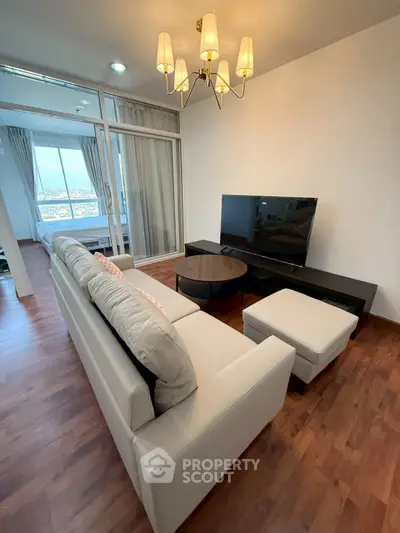 Spacious living room with modern decor and large windows offering stunning views.