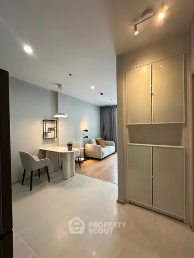 Modern open-plan living room with stylish furniture and elegant lighting