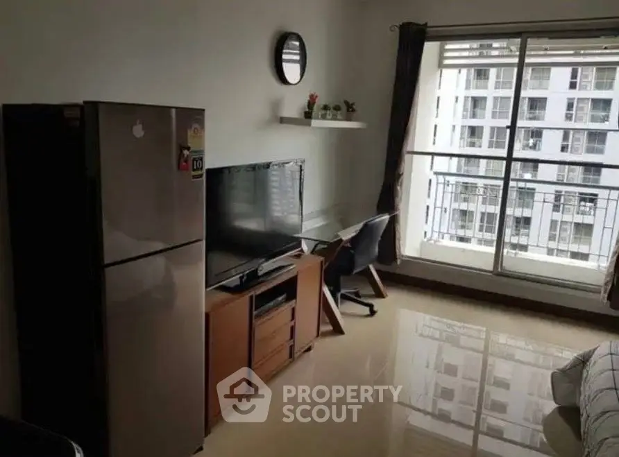 Modern living room with balcony view in high-rise apartment