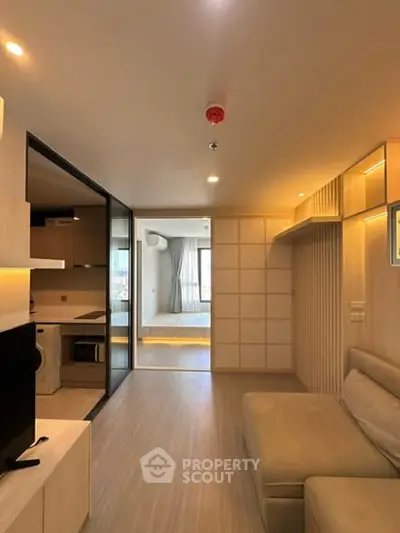 Modern living room with open layout and stylish decor in a contemporary apartment.