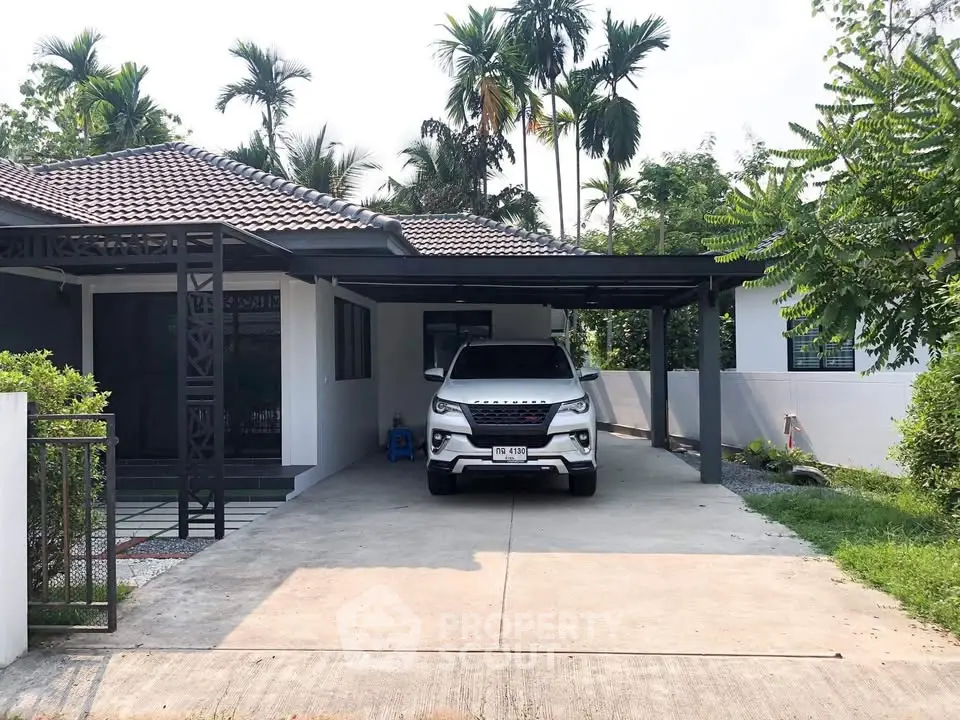 Charming suburban home with carport and lush greenery, perfect for family living.