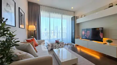 Modern living room with city view, stylish decor, and natural light