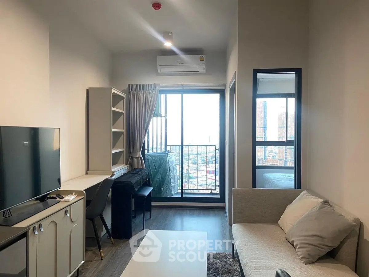 Modern living room with balcony view in high-rise apartment