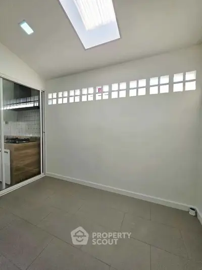 Bright kitchen area with skylight and modern design