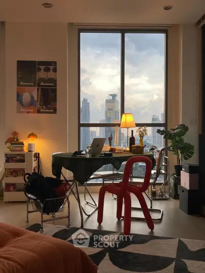 Stylish urban living room with city view, modern furniture, and cozy lighting.