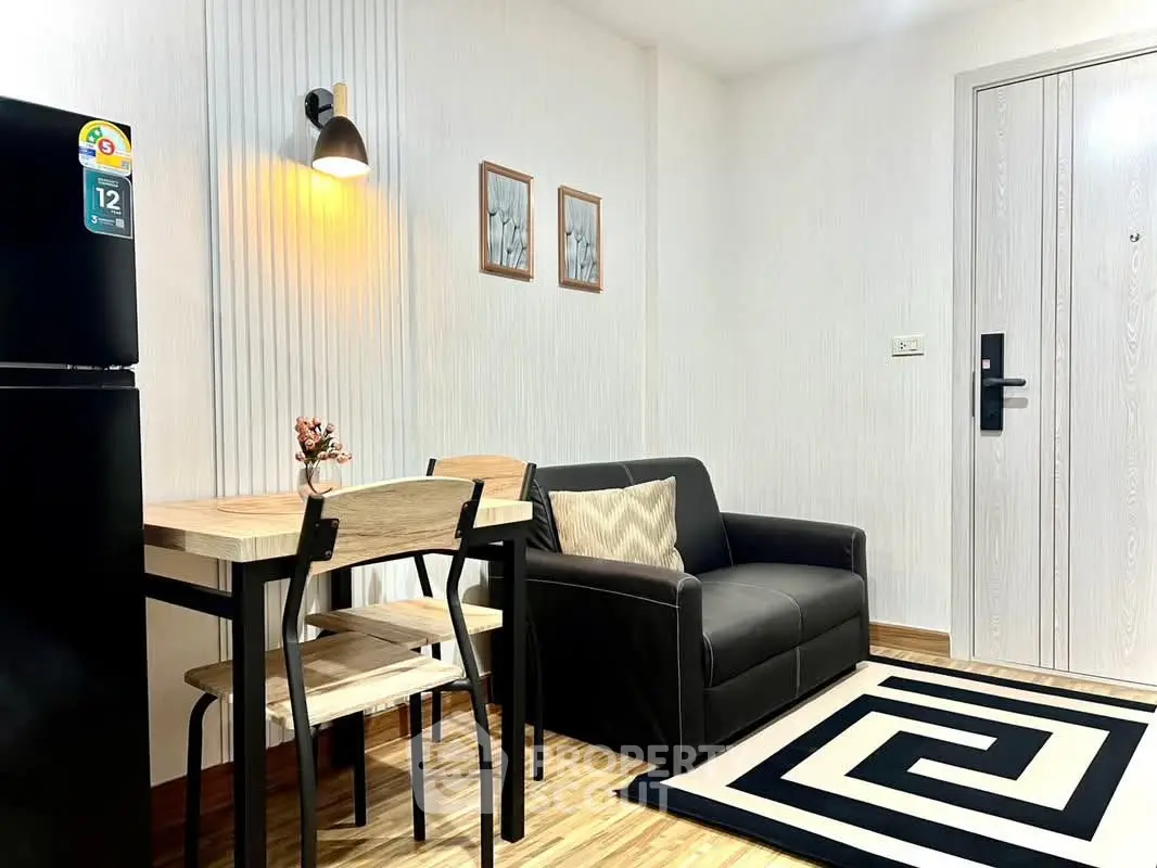 Modern living room with stylish decor and compact dining area