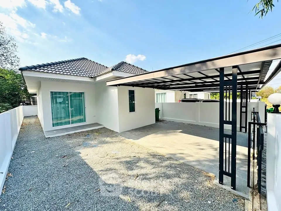 Charming single-story home with modern carport and spacious driveway