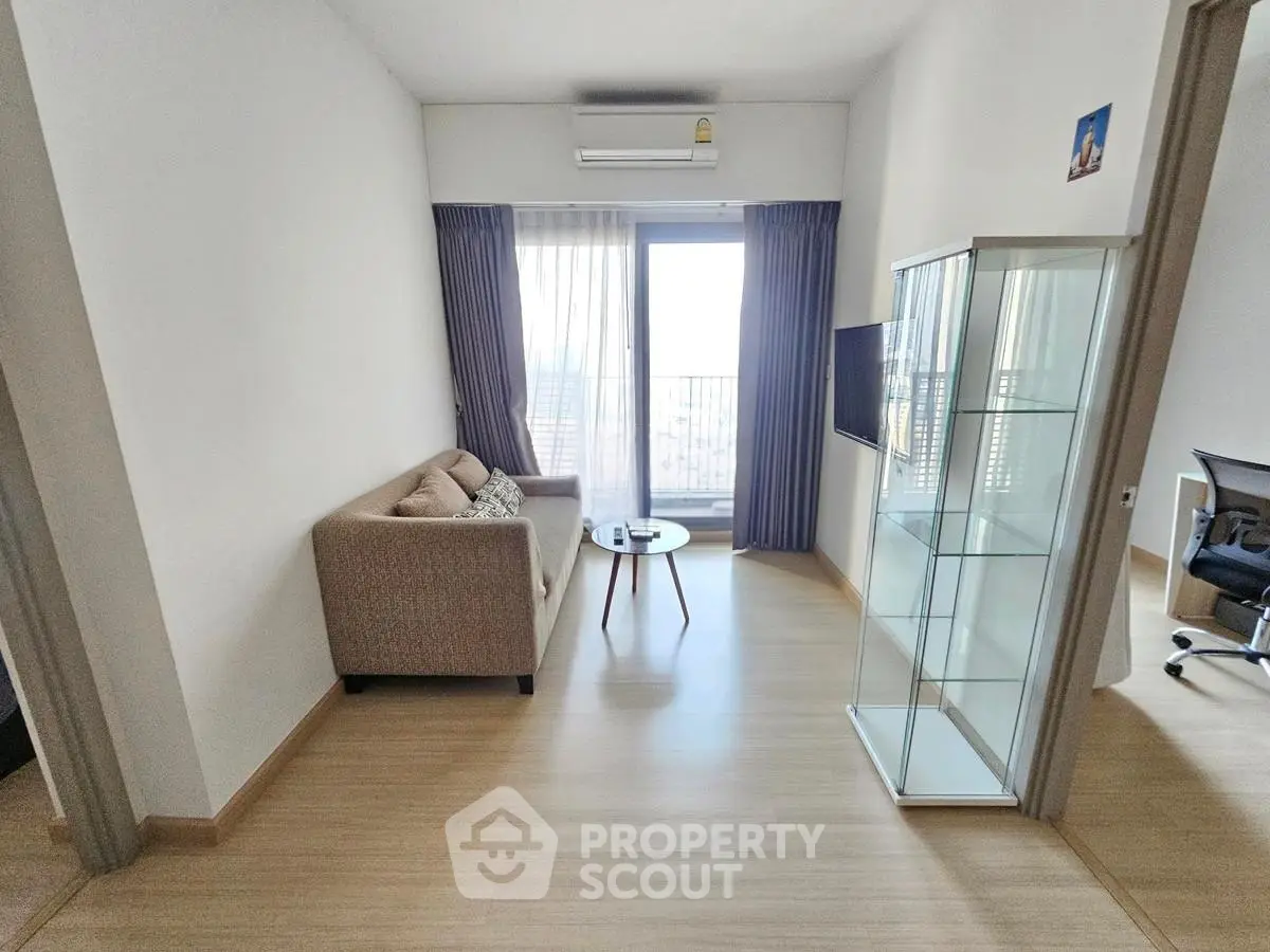 Modern living room with balcony view and stylish furniture