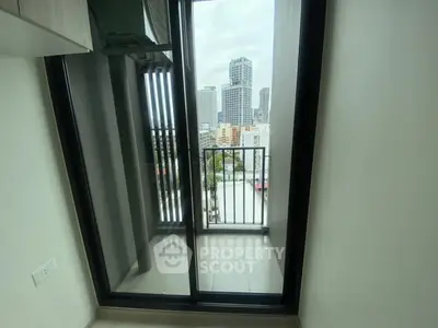 Modern apartment balcony with city skyline view, perfect for urban living.