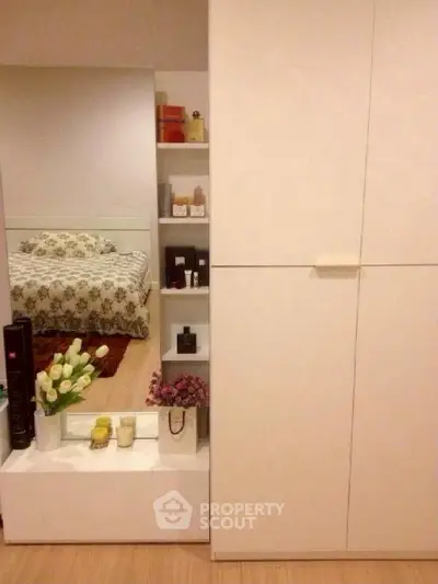 Cozy bedroom with modern wardrobe and decorative shelves