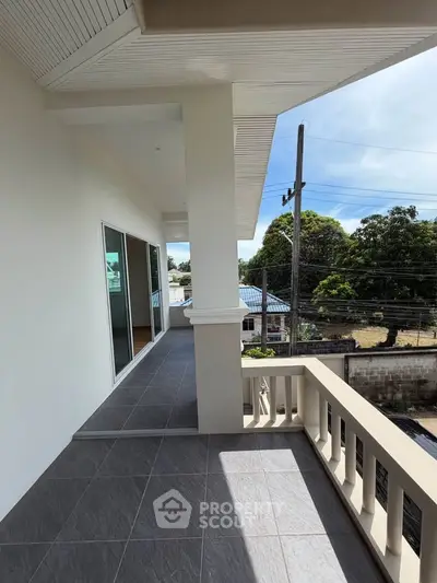 Spacious balcony with modern design and scenic view, perfect for relaxation and outdoor enjoyment.