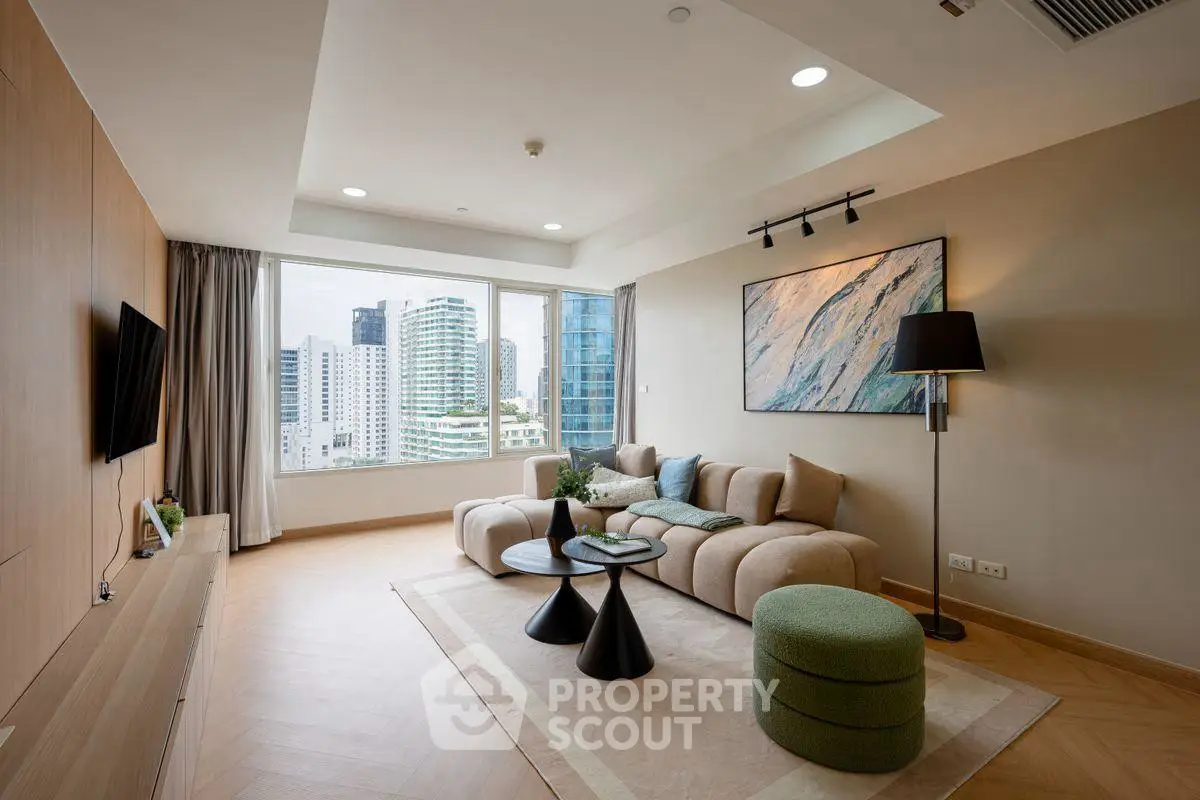 Modern living room with stylish furniture and city view through large window