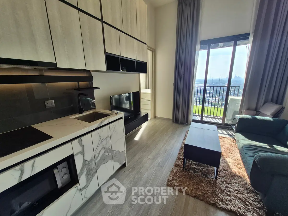 Modern open-layout kitchen and living room with balcony view