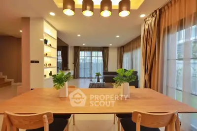 Spacious modern living room with elegant dining area and large windows