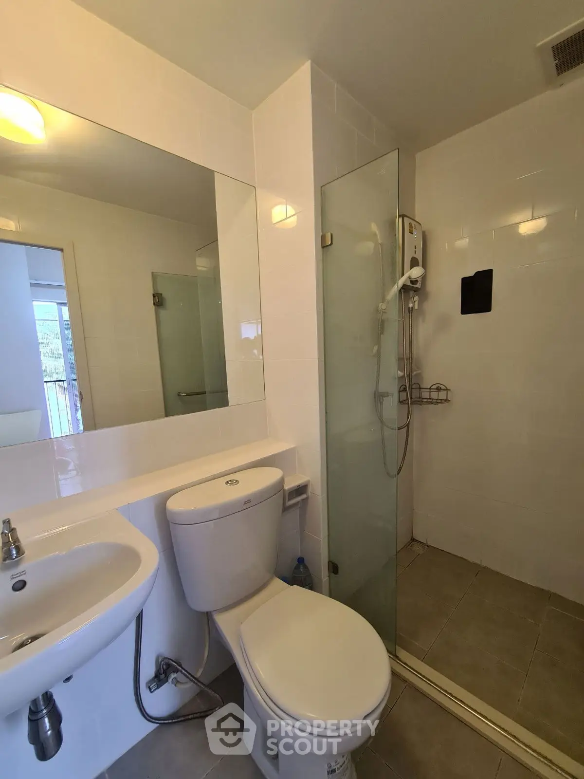 Modern bathroom with glass shower and sleek fixtures