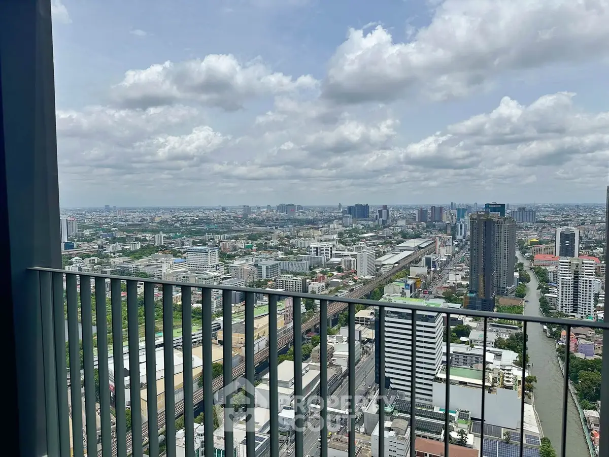 Stunning cityscape view from a high-rise balcony with expansive skyline and urban landscape.