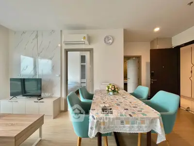 Modern living room with stylish dining area and elegant decor