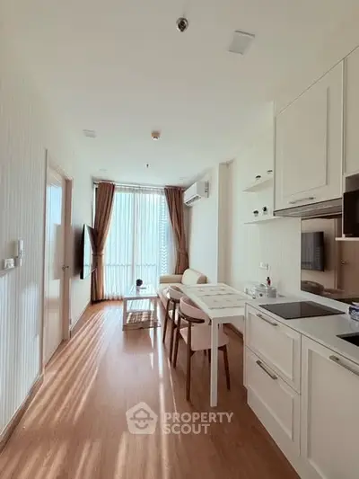 Bright and modern living room with open kitchen in stylish apartment